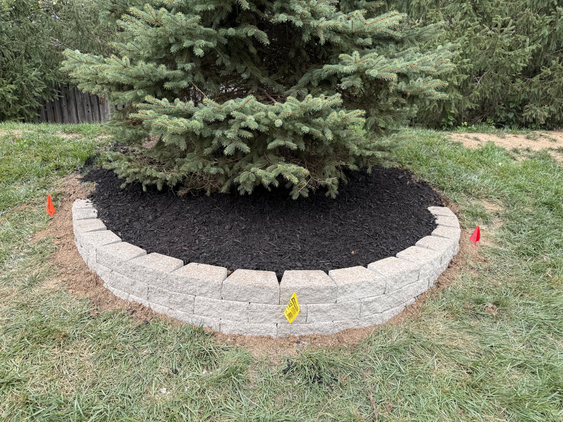 Stone Garden Bed Wall Keeps Mulch Where It Belongs image